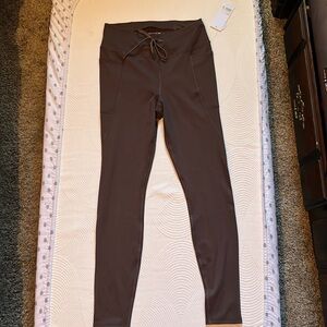 Brand new with tags leggings, has pockets on both sides, ties in the front